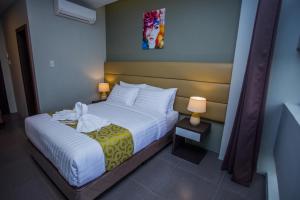 Postel nebo postele na pokoji v ubytování Hotel Costa Brava