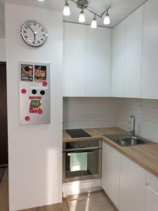 Kuchyň nebo kuchyňský kout v ubytování Apartament Zamojska - GarwoNocka