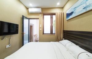 Ένα ή περισσότερα κρεβάτια σε δωμάτιο στο Zai Yang Inn