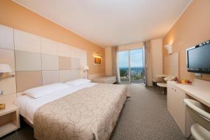 Hotel Mirta - San Simon Resort客房内的一张或多张床位