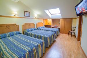 Postel nebo postele na pokoji v ubytování Hotel Río Cabia + 37 fotografií