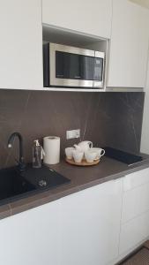 Kuchyňa alebo kuchynka v ubytovaní Aquamarina Onyx 109
