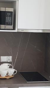 Kuchyňa alebo kuchynka v ubytovaní Aquamarina Onyx 109
