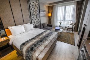 Ένα ή περισσότερα κρεβάτια σε δωμάτιο στο Shimall Hotel +27 φωτογραφίες