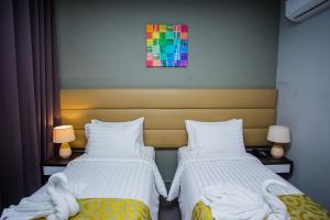 Postel nebo postele na pokoji v ubytování Hotel Costa Brava