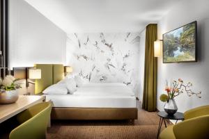 מיטה או מיטות בחדר ב-Best Western Hotel Favorit