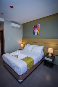 Postel nebo postele na pokoji v ubytování Hotel Costa Brava