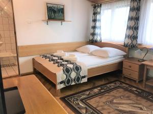 Łóżko lub łóżka w pokoju w obiekcie Pensjonat Adria