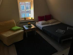 Posedenie v ubytovaní Apartament na poddaszu