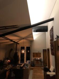 a living room with a ceiling fan in a room at Quinta do Ragal in Lavacolhos
