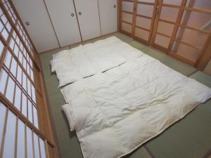 民泊こゆり客房内的一张或多张床位