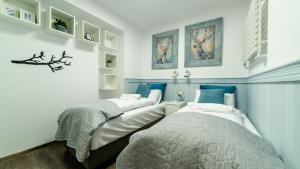 Posteľ alebo postele v izbe v ubytovaní Apartamenty Sun & Snow Sarnia Residence