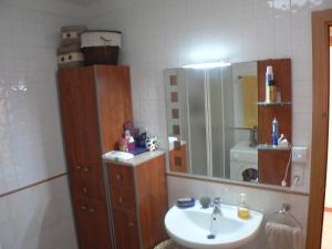 a bathroom with a sink and a mirror at Mas Pinell 129 in Torroella de Montgrí +10 photos