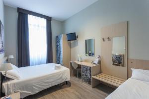 Postel nebo postele na pokoji v ubytování Best Quality Hotel Dock Milano