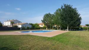 a swimming pool in the middle of a yard at Mas Pinell 129 in Torroella de Montgrí