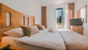 Postel nebo postele na pokoji v ubytování Veya Maradiso Hotel by Aminess