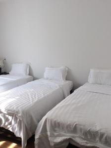 Postel nebo postele na pokoji v ubytování Hoang Y Homestay