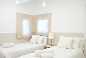 Posteľ alebo postele v izbe v ubytovaní Cream homes La Rambla, TURISMO DE INTERIOR