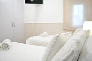 Posteľ alebo postele v izbe v ubytovaní Cream homes La Rambla, TURISMO DE INTERIOR