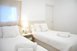 Posteľ alebo postele v izbe v ubytovaní Cream homes La Rambla, TURISMO DE INTERIOR