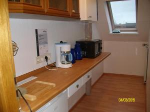 Køkken eller tekøkken på Gästehaus Hemmerdeich-alte Schule + 26 billeder