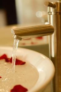 a sink with water running from a faucet at Lagoon Homestay Hoi An in Hoi An +31 photos