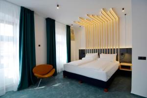 Ένα ή περισσότερα κρεβάτια σε δωμάτιο στο Kleines Hotel