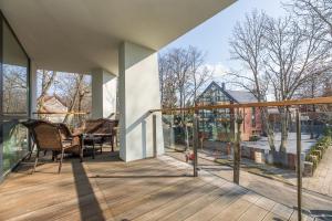 a balcony with a view of a house at Simpsono apartamentai №215 in Palanga