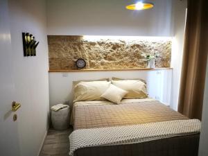 Postel nebo postele na pokoji v ubytování Amelia Apts & Rooms