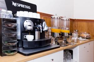 a coffee maker sitting on top of a counter at Hotel Madrid in Las Palmas de Gran Canaria