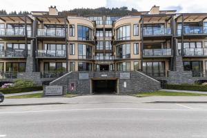 a large apartment building with a tunnel in front of it at The Beacon - Luxe Studio Unit in Queenstown