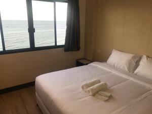 Babylon Oslob Coast Guesthouse客房内的一张或多张床位
