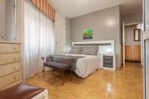 En eller flere senge i et værelse på Hospedaxe Maria Aguiño