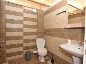 a bathroom with a toilet and a sink at Frezia Complex - Frezia Apartments in Nea Potidaea +38 photos
