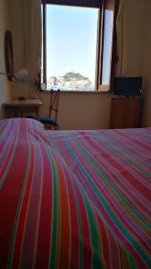 Postel nebo postele na pokoji v ubytování VisitPonza - Le Stanze Sulla Spiaggia