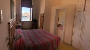 Postel nebo postele na pokoji v ubytování VisitPonza - Le Stanze Sulla Spiaggia