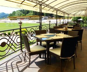 A restaurant or other place to eat at Olymp Hotel