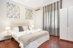 Voodi või voodid majutusasutuse Stay U-nique Apartments Calvet toas