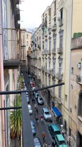 a view of a city street with cars and buildings at Borgo Angioino in Naples