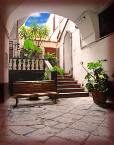 an alley with a bench in front of a building at Casa Fabiana in Sorrento