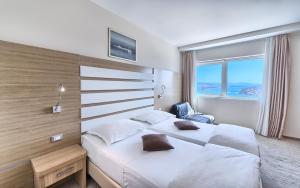Postel nebo postele na pokoji v ubytování Hotel Panorama