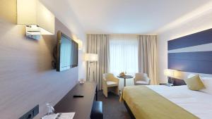 Letto o letti in una camera di Parc Hotel Alvisse