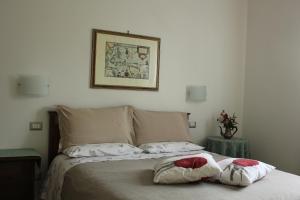 Postel nebo postele na pokoji v ubytování B&B Il Giardino Di Isa