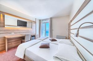 Postel nebo postele na pokoji v ubytování Hotel Panorama