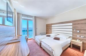 Postel nebo postele na pokoji v ubytování Hotel Panorama