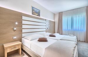 Postel nebo postele na pokoji v ubytování Hotel Panorama
