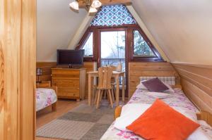 Ein Bett oder Betten in einem Zimmer der Unterkunft Pensjonat Jastrzębia Turnia