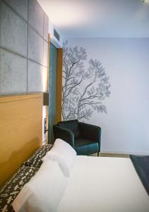 En eller flere senge i et værelse på Hotel EH Piedra Y Luz