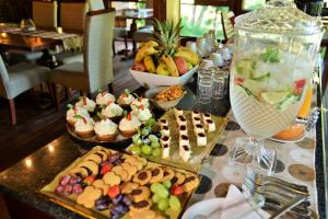 a table with many different types of food on it at Imbali Safari Lodge in Mluwati Concession 