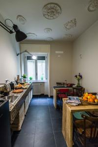 a kitchen with a table and a sink at B&B WelcHome in Enna